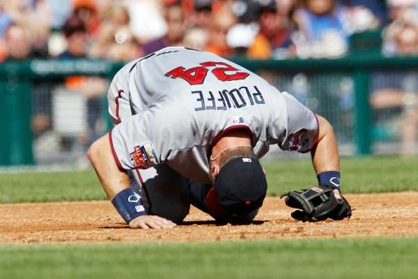 Trevor Plouffe injured himself diving for a ground ball in Saturday's game in Detroit. (Duane Burleson/Getty Images)